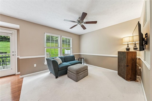 8201 Club Side Dr, Adams Twp, PA 16046 - sitting room with baseboards, healthy amount of natural light, a ceiling fan, and a textured ceiling