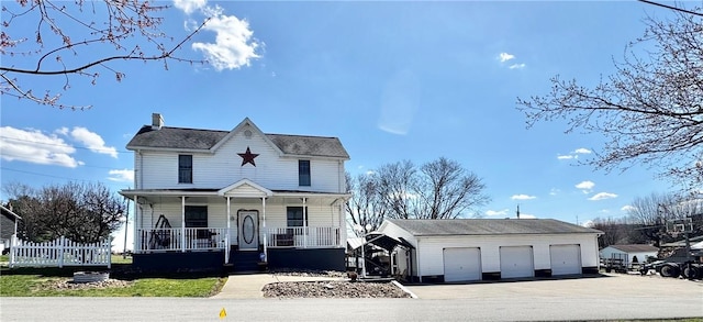 211 Stephens St, Vanderbilt, PA 15486 - view of front of home with a garage, a porch, an outbuilding, and a chimney