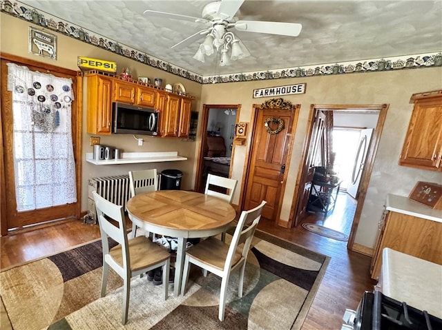 211 Stephens St, Vanderbilt, PA 15486 - dining area featuring wood finished floors, ceiling fan, and baseboards