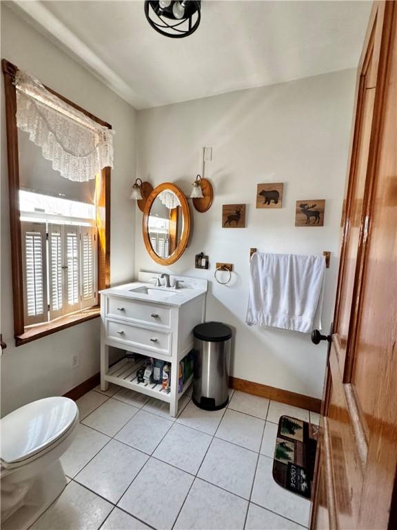 211 Stephens St, Vanderbilt, PA 15486 - half bathroom featuring vanity, toilet, tile patterned floors, and baseboards