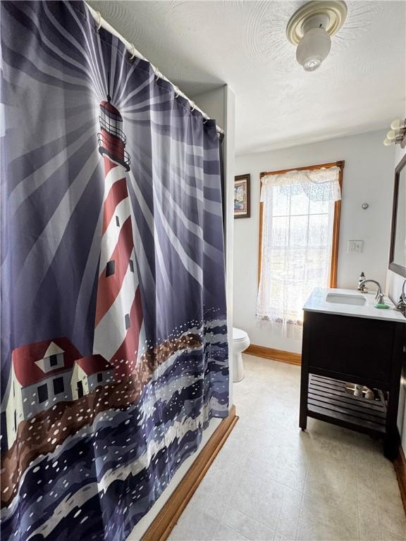 211 Stephens St, Vanderbilt, PA 15486 - full bath with vanity, toilet, baseboards, and a shower with curtain
