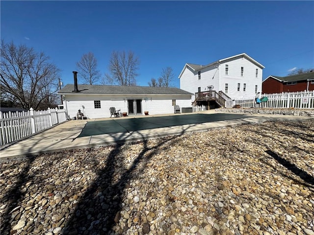 211 Stephens St, Vanderbilt, PA 15486 - rear view of house featuring french doors, a patio, a fenced backyard, and cooling unit
