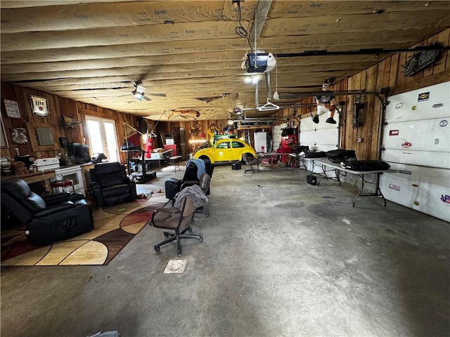 211 Stephens St, Vanderbilt, PA 15486 - garage featuring wooden walls, a garage door opener, and electric panel
