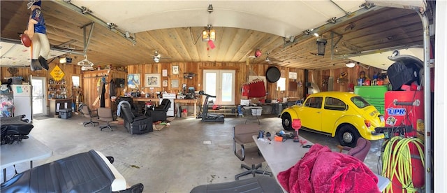 211 Stephens St, Vanderbilt, PA 15486 - garage with wooden walls and freestanding refrigerator
