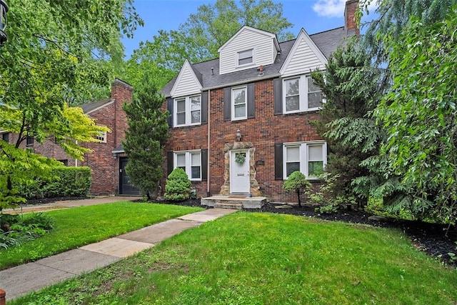 273 Inglewood Dr, Mt Lebanon, PA 15228 - view of front of property with a front yard, brick siding, and a shingled roof