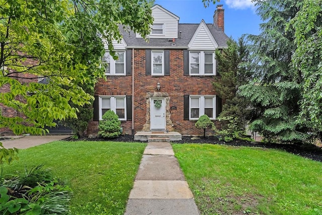 273 Inglewood Dr, Mt Lebanon, PA 15228 - view of front of home featuring a chimney, a front yard, and brick siding