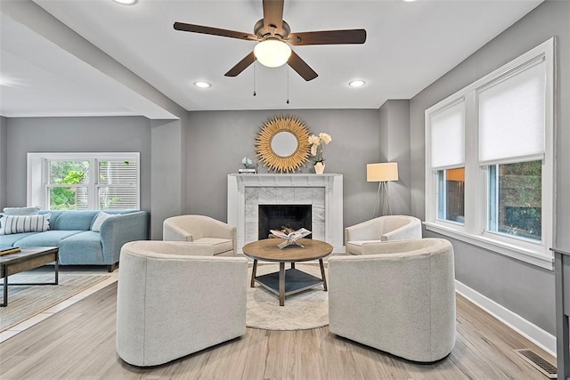 273 Inglewood Dr, Mt Lebanon, PA 15228 - living area featuring a tiled fireplace, a ceiling fan, light wood-style floors, baseboards, and recessed lighting