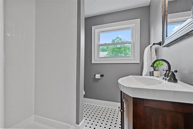 273 Inglewood Dr, Mt Lebanon, PA 15228 - bathroom featuring vanity, a tile shower, baseboards, and tile patterned floors