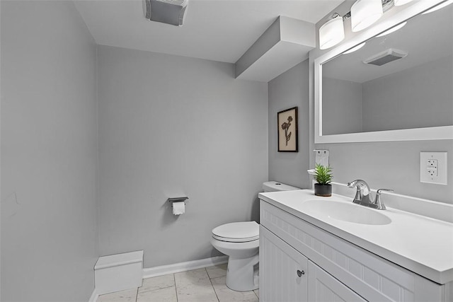273 Inglewood Dr, Mt Lebanon, PA 15228 - bathroom with marble finish floors, toilet, vanity, and baseboards