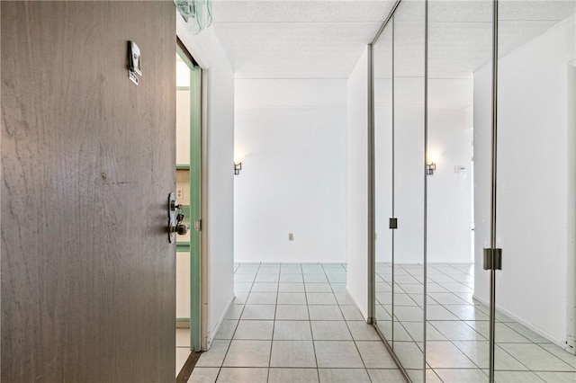 5600 Munhall Rd Unit 606, Squirrel Hill, PA 15217 - hallway with light tile patterned floors and baseboards