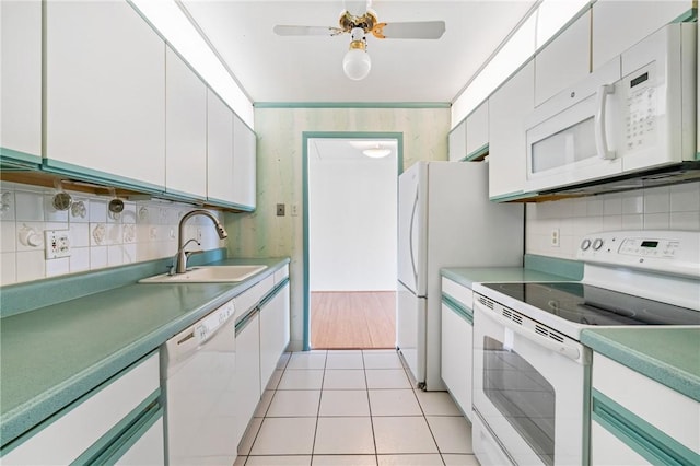 5600 Munhall Rd Unit 606, Squirrel Hill, PA 15217 - kitchen featuring white appliances, a sink, backsplash, and white cabinetry