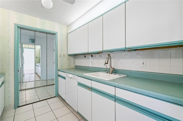 5600 Munhall Rd Unit 606, Squirrel Hill, PA 15217 - kitchen featuring dishwasher, a sink, white cabinetry, light tile patterned floors, and tasteful backsplash