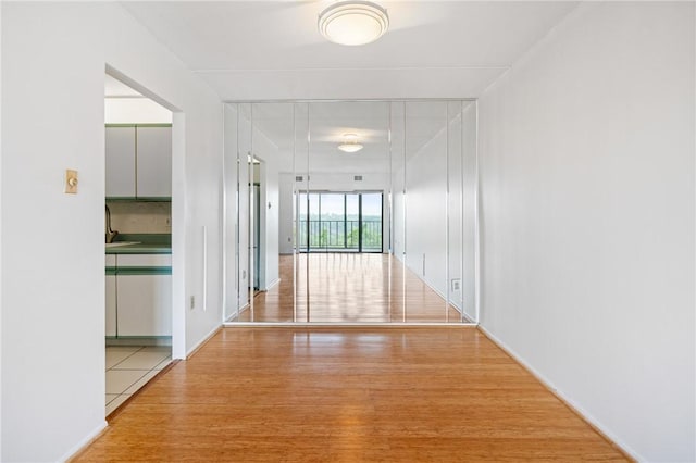 5600 Munhall Rd Unit 606, Squirrel Hill, PA 15217 - corridor featuring wood finished floors, baseboards, and a sink