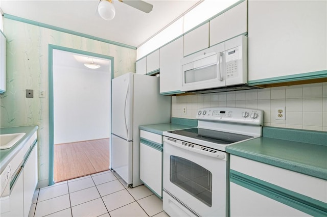 5600 Munhall Rd Unit 606, Squirrel Hill, PA 15217 - kitchen with white appliances, tasteful backsplash, and white cabinets