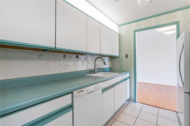 5600 Munhall Rd Unit 606, Squirrel Hill, PA 15217 - kitchen with white appliances, a sink, white cabinetry, and backsplash