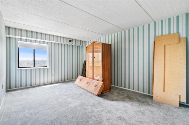 5600 Munhall Rd Unit 606, Squirrel Hill, PA 15217 - unfurnished bedroom with wallpapered walls, carpet, and a textured ceiling
