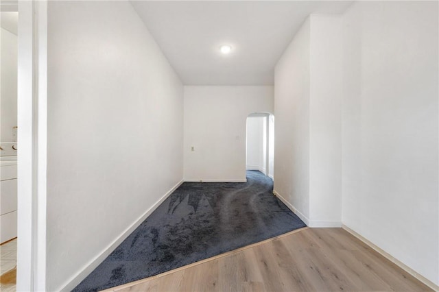 636 Edmond St, Bloomfield, PA 15224 - hallway featuring arched walkways, wood finished floors, and baseboards
