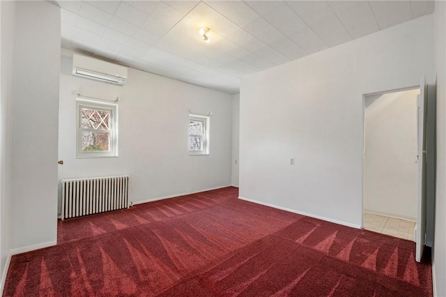 636 Edmond St, Bloomfield, PA 15224 - carpeted spare room with radiator and a wall mounted air conditioner