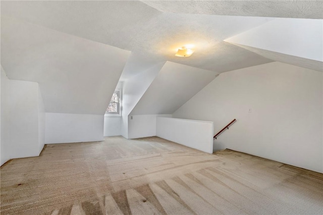 636 Edmond St, Bloomfield, PA 15224 - bonus room featuring lofted ceiling, carpet, and a textured ceiling