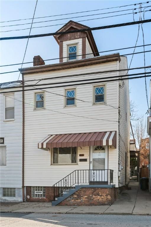 636 Edmond St, Bloomfield, PA 15224 - view of front of home with a chimney