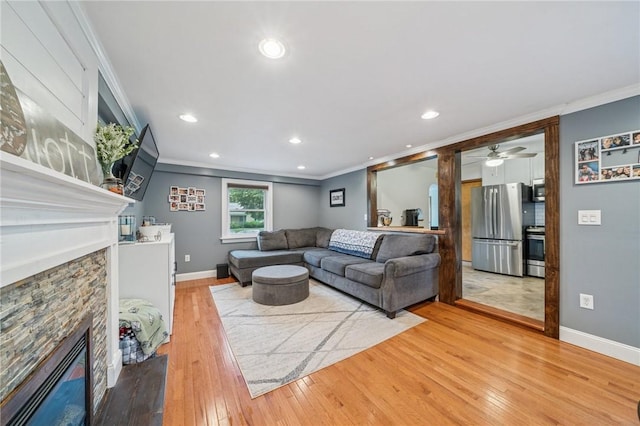 1507 Woodlawn Dr, Unity Twp, PA 15650 - living room featuring a fireplace, light wood-style flooring, crown molding, baseboards, and recessed lighting