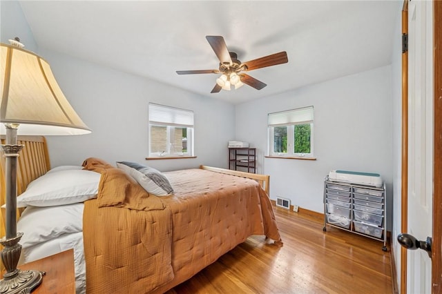 1507 Woodlawn Dr, Unity Twp, PA 15650 - bedroom with wood finished floors, ceiling fan, and baseboards