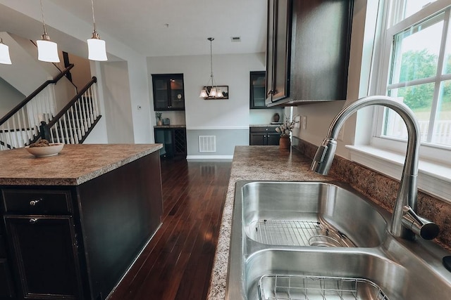 2014 Black Bear Way, Bridgeville, PA 15017 - kitchen with a sink, dark wood-style floors, decorative light fixtures, baseboards, and a center island