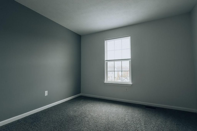 2014 Black Bear Way, Bridgeville, PA 15017 - spare room featuring dark colored carpet and baseboards