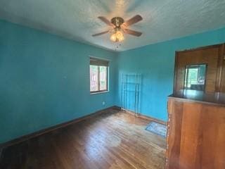 798 Hecla Rd, Mount Pleasant Twp Wml, PA 15666 - unfurnished bedroom with wood finished floors, baseboards, a textured ceiling, and ceiling fan