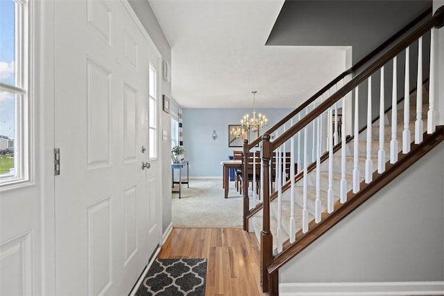 1033 Granite Dr, South Fayette, PA 15057 - foyer entrance featuring wood finished floors, baseboards, a chandelier, and stairs