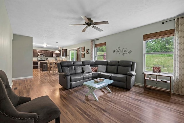 1033 Granite Dr, South Fayette, PA 15057 - living room featuring dark wood-style flooring, ceiling fan, and baseboards