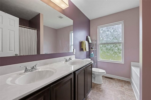 1033 Granite Dr, South Fayette, PA 15057 - bathroom featuring toilet, double vanity, baseboards, and plenty of natural light