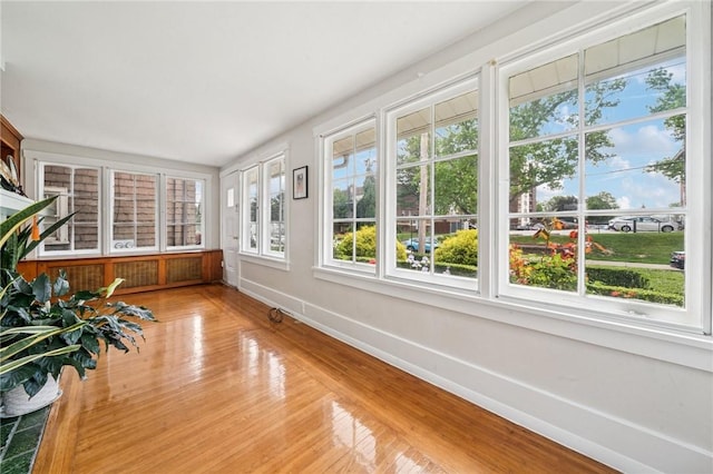 7333 Mcclure Ave, Swissvale, PA 15218 - unfurnished sunroom featuring baseboards and wood finished floors