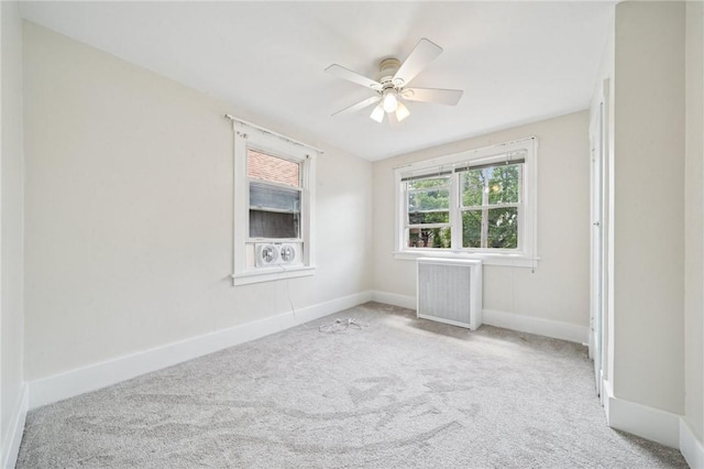 7333 Mcclure Ave, Swissvale, PA 15218 - spare room with radiator heating unit, carpet flooring, a ceiling fan, and baseboards