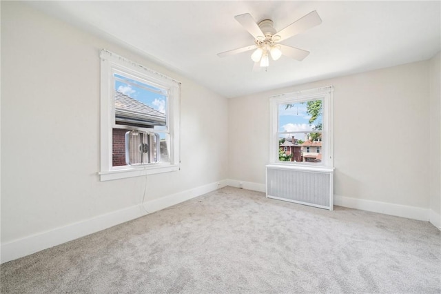 7333 Mcclure Ave, Swissvale, PA 15218 - carpeted spare room with radiator heating unit, baseboards, and a ceiling fan