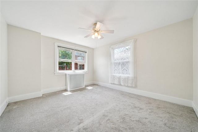 7333 Mcclure Ave, Swissvale, PA 15218 - carpeted empty room with a ceiling fan, radiator heating unit, and baseboards