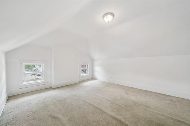 7333 Mcclure Ave, Swissvale, PA 15218 - additional living space with carpet flooring, vaulted ceiling, plenty of natural light, and baseboards
