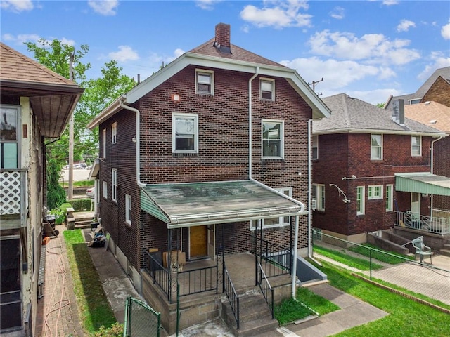 7333 Mcclure Ave, Swissvale, PA 15218 - view of front of property with brick siding and a chimney