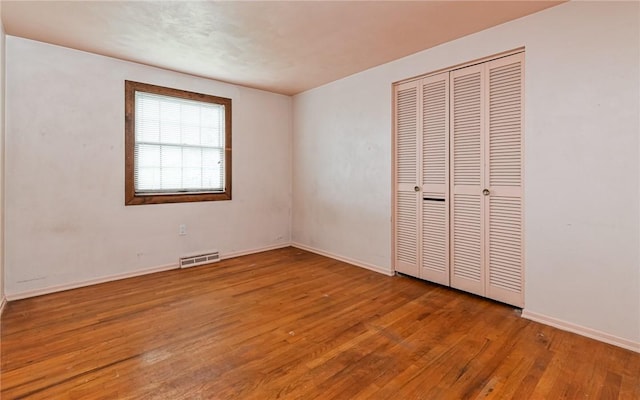 4610 School Dr, Hampton, PA 15101 - unfurnished bedroom featuring wood finished floors, baseboards, and a closet