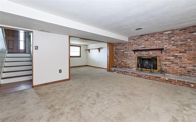 4610 School Dr, Hampton, PA 15101 - unfurnished living room with carpet floors, a brick fireplace, baseboards, and stairway