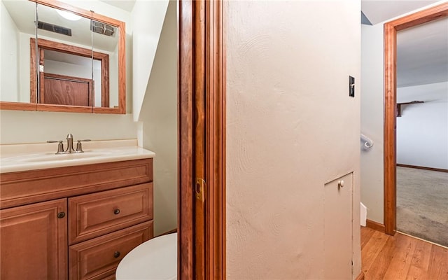 4610 School Dr, Hampton, PA 15101 - bathroom with vanity, wood finished floors, and toilet