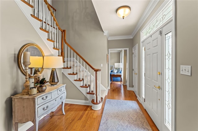 105 Pin Oak Ct, Peters Twp, PA 15367 - entryway featuring light wood-style floors, ornamental molding, stairs, and baseboards