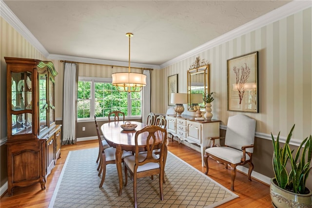 105 Pin Oak Ct, Peters Twp, PA 15367 - dining space featuring ornamental molding, light wood-style floors, a chandelier, baseboards, and wallpapered walls
