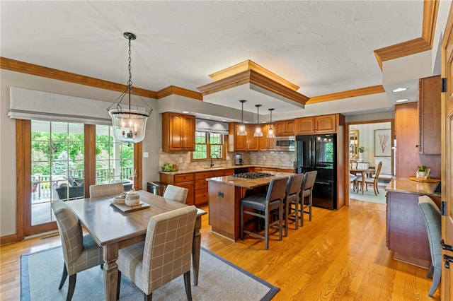 105 Pin Oak Ct, Peters Twp, PA 15367 - dining room with crown molding, light wood-style flooring, and a chandelier