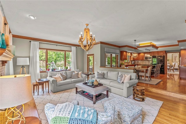 105 Pin Oak Ct, Peters Twp, PA 15367 - living area featuring a chandelier, ornamental molding, and light wood finished floors