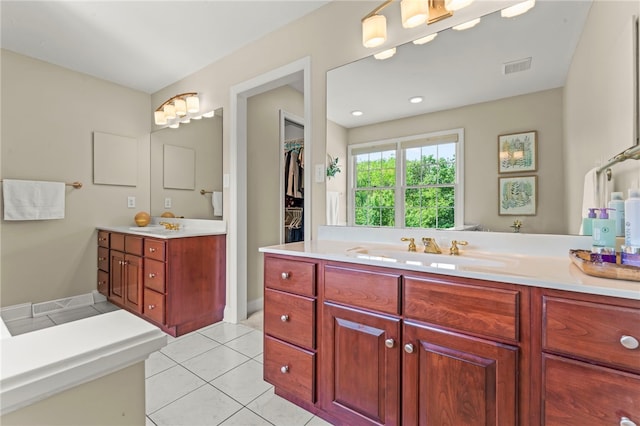 105 Pin Oak Ct, Peters Twp, PA 15367 - full bath with two vanities, tile patterned floors, and a spacious closet