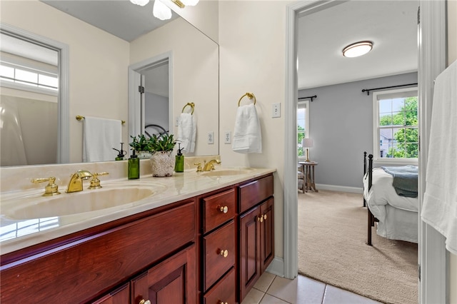 105 Pin Oak Ct, Peters Twp, PA 15367 - bathroom with ensuite bathroom, double vanity, baseboards, and tile patterned floors