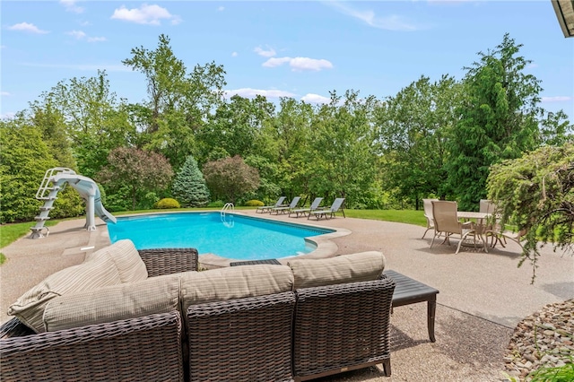 105 Pin Oak Ct, Peters Twp, PA 15367 - outdoor pool with a water slide, a patio, and view of scattered trees