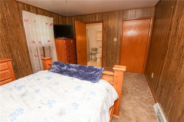 23 Main St, W Pike Run Twp, PA 15427 - bedroom with wooden walls, light carpet, and ensuite bath