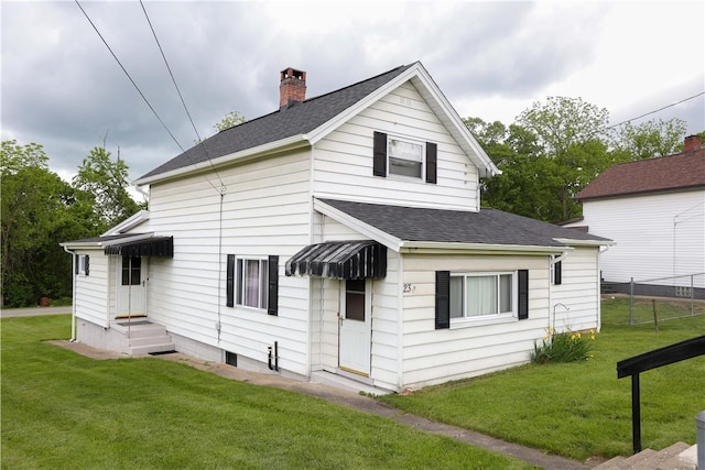 23 Main St, W Pike Run Twp, PA 15427 - back of property with a shingled roof and a chimney